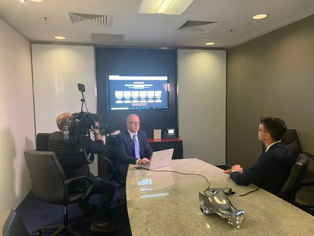A client being interviewed on camera