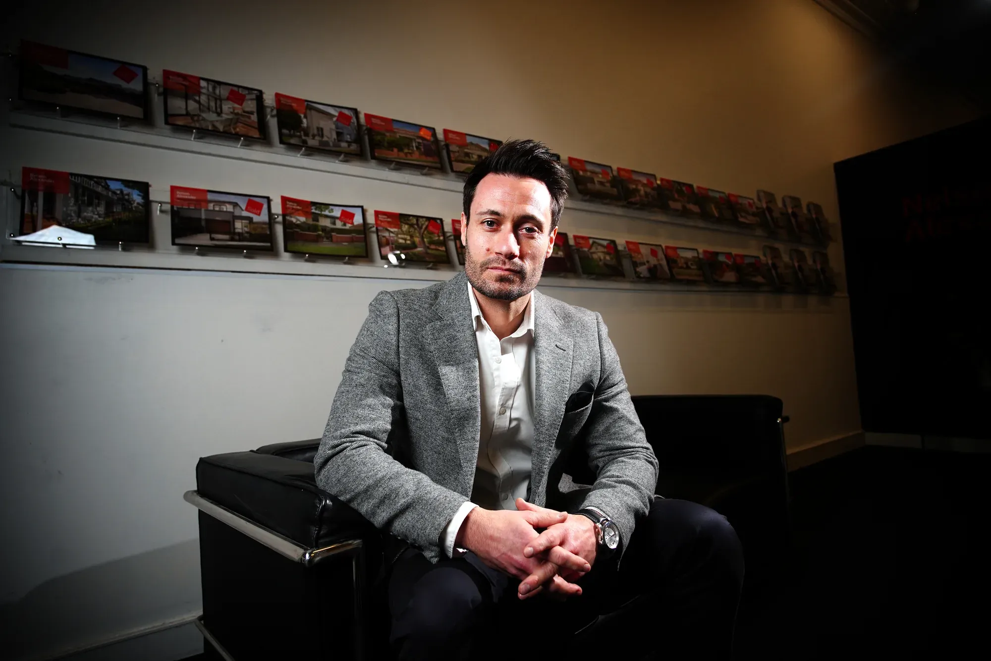 A client photographed in a gallery ahead of an interview