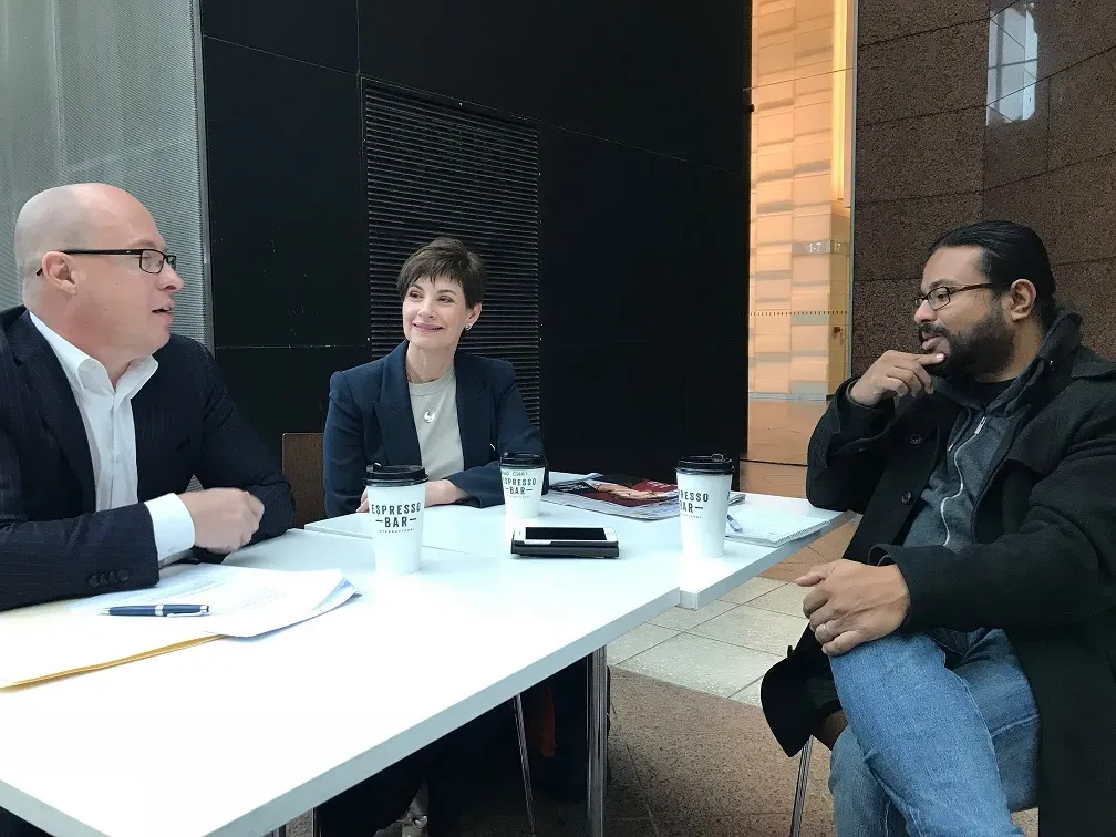A media training session around a boardroom table