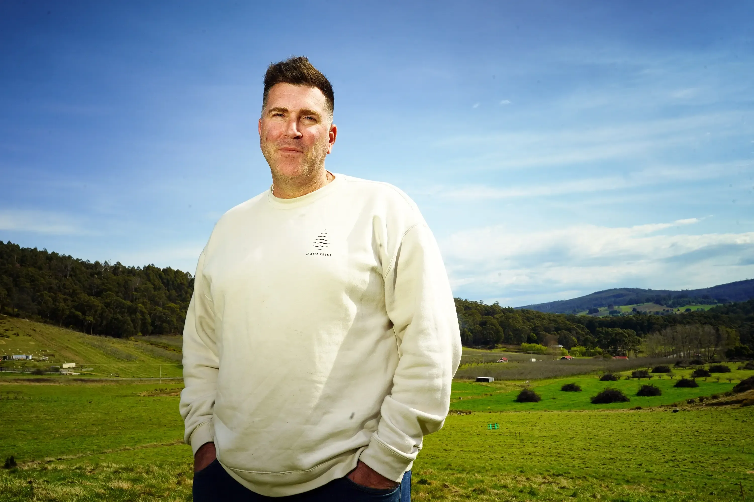 A Pure Mist representative standing above the property the water is sourced from