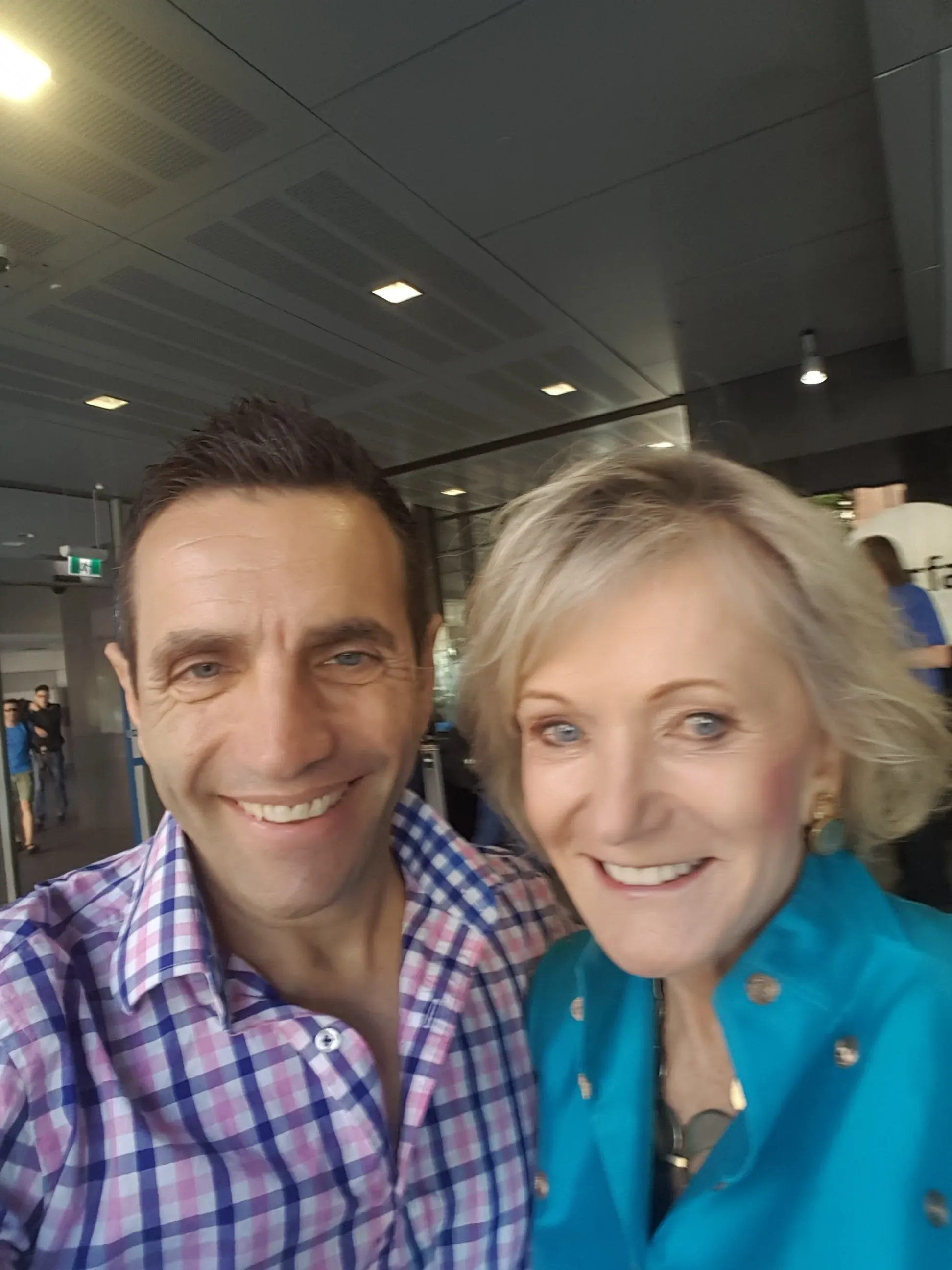 Two clients photographed together at an event